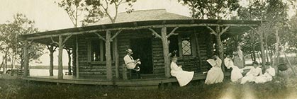 F.M.Smith and guests on Cedar Island cabin porch